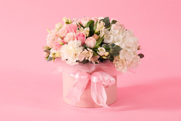 Bouquet of beautiful flowers on pink background