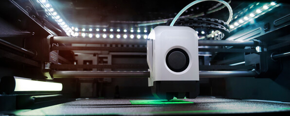 A High-Tech 3D Printer Is Operating in a Dimly Lit Workspace, Producing an Intricate Design With Precision. Bright Lights Illuminate the Printer’s Components, Showcasing Its Advanced Technology.