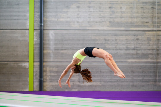Gymnast exercising on a mat