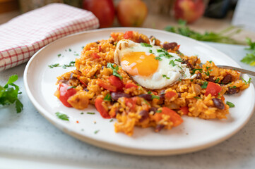 Spicy vegetables rice and bean dish with fried egg fresh and homemade cooked. Healthy gluten free and vegetarian food