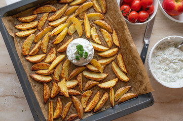 Homemade potato wedges with herb quark. Healthy gluten free meal
