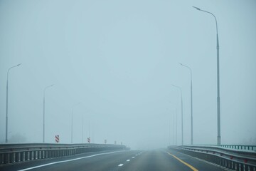 The road is in the fog. Atmospheric phenomenon