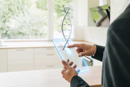 Hamd holding hologram of DNA model