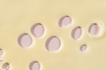 Smooth Yellow Cheese with Characteristic Holes