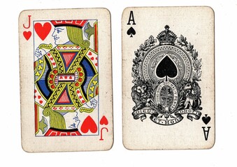 A blackjack or pontoon hand of vintage playing cards on a white background.