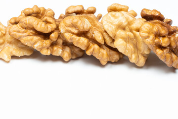 Shelled walnuts on a white background close-up