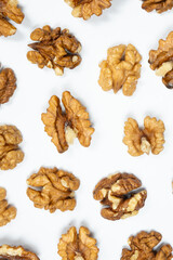 Walnut kernels, white background, top view.
