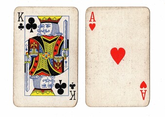 A blackjack or pontoon hand of vintage playing cards on a white background.