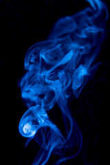 blue smoke on black background