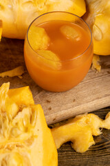 a ripe orange pumpkin with seeds and pumpkin juice cut into pieces