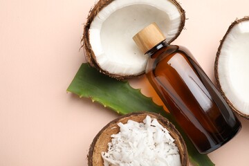 Hair treatment. Cosmetic product, coconut, butter shavings and aloe leaves on beige background, flat lay