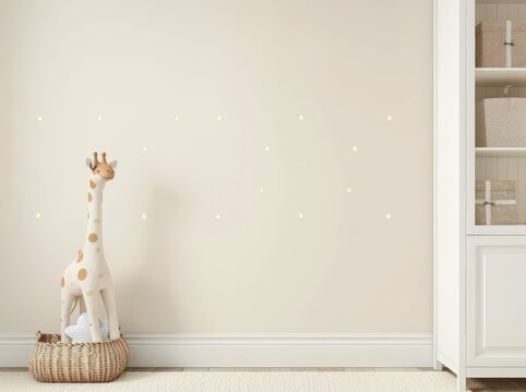 A white nursery room with a giraffe toy in a basket and star wall decals
