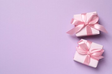 Beautiful gift boxes on color background