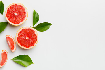 fresh Fruit grapefruit with Juicy grapefruit slices on colored background. Top view. Copy Space....