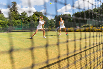 Mature women during a tennis match on grass court