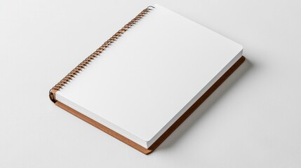 Top view of a spiral-bound notebook with a brown cover on a white background, ideal for stationery stock images.