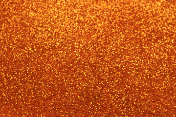 Shiny orange glitter texture background
