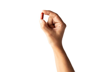 Male hand holding a red pill isolated no background