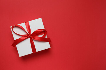 Beautiful gift box on color background 