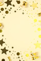 Golden confetti on color background, top view