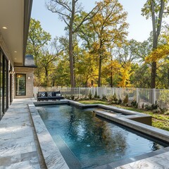 Luxury swimming pool at a home backyard on sunny autumn day, leisure space