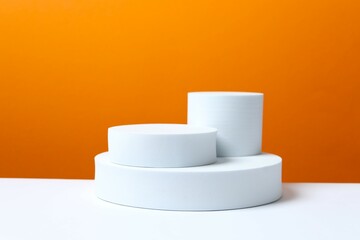 White podiums on color background 