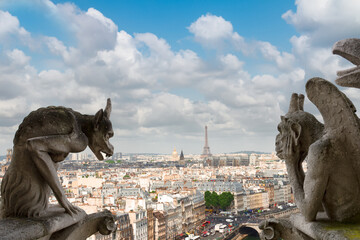 Gargoyle of Paris on Notre Dame Cathedral church and Paris cityscape from above, France