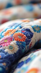 Fototapeta premium Colorful floral quilt detail, bedroom