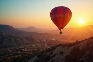 Obraz premium Hot air balloon soaring above vast open landscape at dawn, peaceful, open landscape