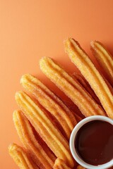 Golden churros arranged artfully beside rich chocolate dip, vibr