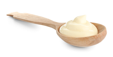 Tasty mayonnaise sauce in wooden spoon isolated on white