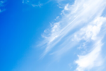 Idyllic white fluffy clouds in the blue sky