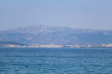 Contemporary buildings, gardens and beaches at the waterfront in Split, Croatia. View of Split from the boat.