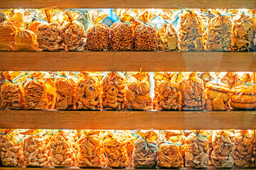 desserts and other grain products packed in polyethylene on the counter in the bakery