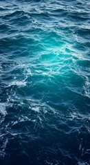 Aerial View of Turbulent Ocean Waves with Dynamic Patterns and Vibrant Blue Hues