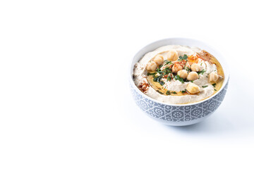 Chickpea hummus with olive oil, parsley and paprika in bowl isolated on white background. Copy space