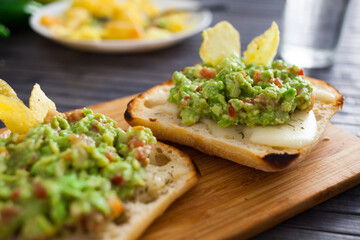 Morning toast with melted cheese and guacamol