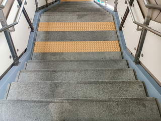 A quiet, empty staircase can evoke a sense of calm and solitude.