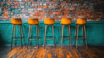Empty bar stools, brick wall, teal counter, wood floor, pub interior