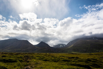 Icelandic landscape with mountains, clouds and icelandic landscape