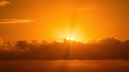 Fototapeta premium Dramatic Sunset Sky with Glowing Sun Rays Through Clouds, Fiery Sunset Behind Clouds, Breathtaking Sky Scene