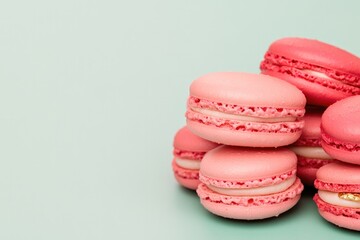 Fototapeta premium Colorful macarons stacked artfully, showcasing delicate textures