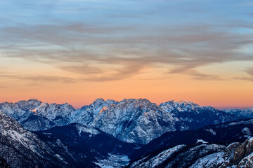 Dramatic Snowy Peaks of the mountains at Sunset