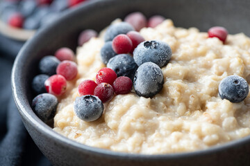 Oatmeal with berries closeup view