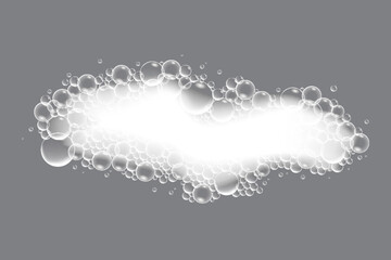 Soap bubbles, displaying unique designs, gracefully float on a plain gray surface