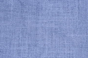 Blue woven fabric texture with a detailed grid-like pattern and natural fiber structure. Natural textile background, eco-friendly design. Soft and organic material concept