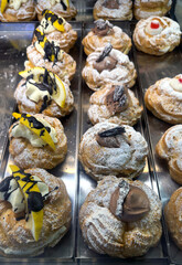 Tray with zeppole of San Giuseppe cooked in the oven. Typical sweets of southern Italy