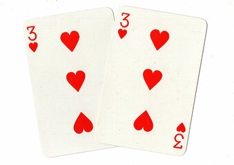 A hand of playing cards showing an identical pair on a white background.