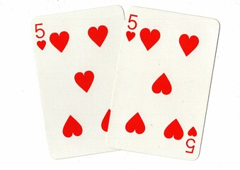 A hand of playing cards showing an identical pair on a white background.