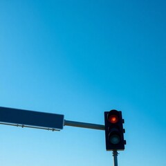 High-resolution stock photo of a traffic light against a clear blue sky, commercial use, professional quality, strong sunlight casting defined shadows, minimal background elements, focus on clean line